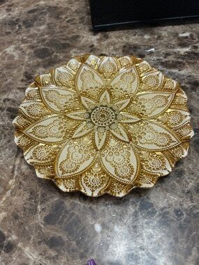 Vintage hand-decorated ceramic decorative plate with a mandala design